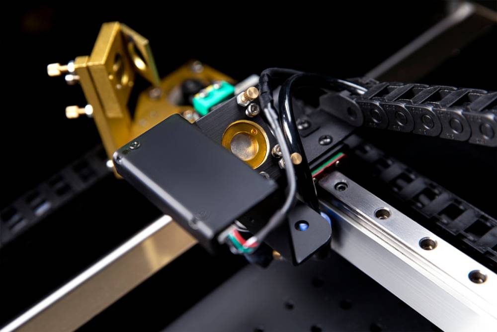 Large FLUX Beambox projects arranged on a table